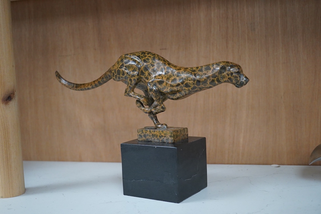 A patinated bronze cheetah bearing J.B. Depose foundry stamp, on slate plinth, 19cm high